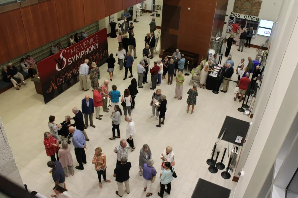 The Venice Symphony hallway with patrons.